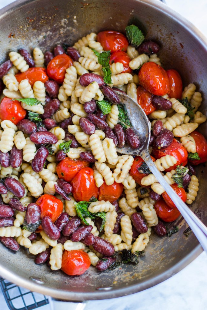 Pasta with beans, tomatoes, and cheese
