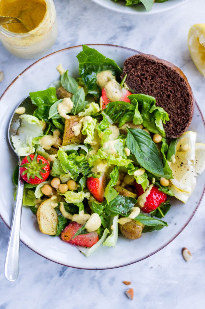 Potato, strawberry, and chickpea salad with the easiest nut butter dressing