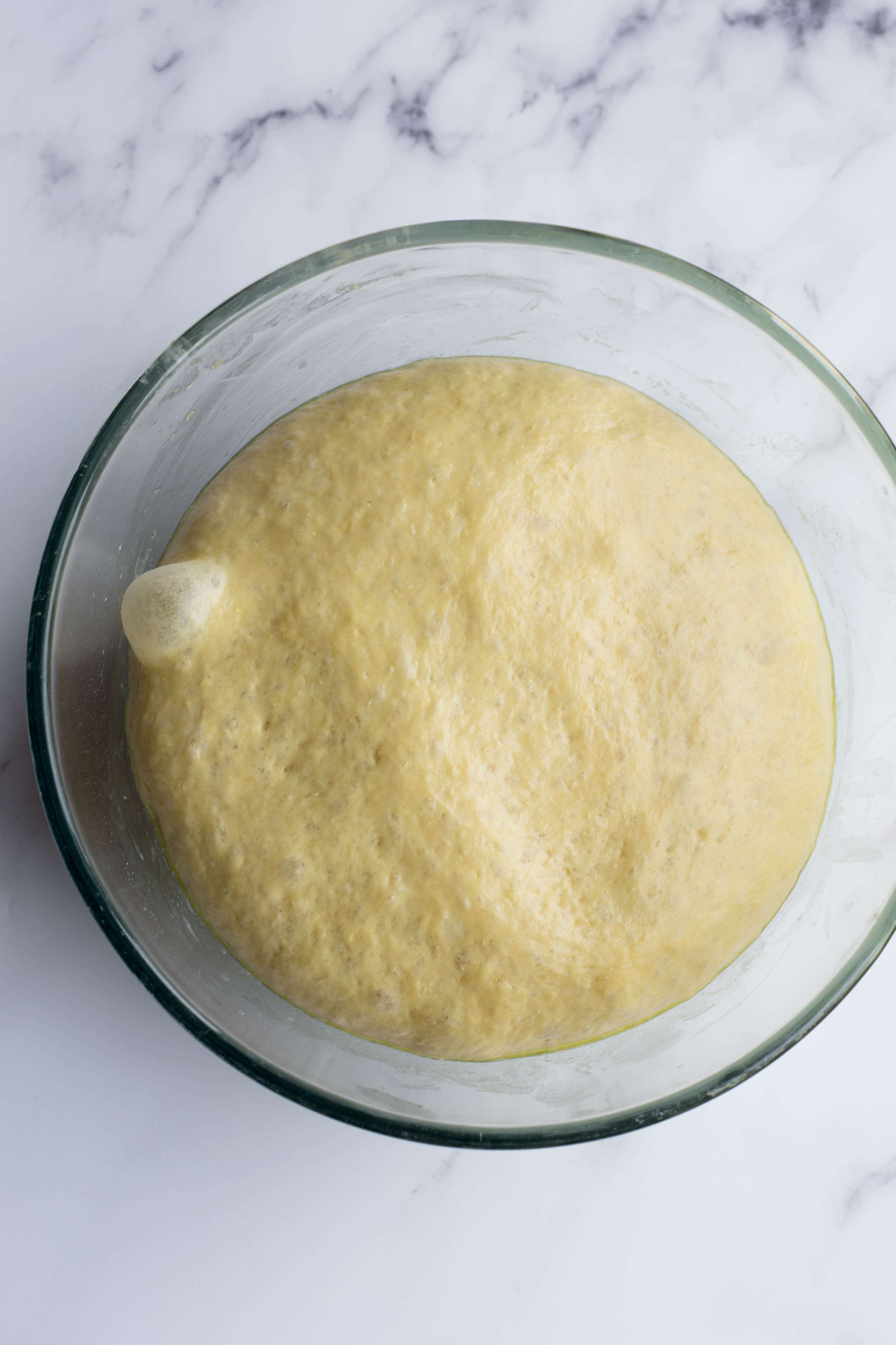 Soft brioche burger buns: the dough after rising