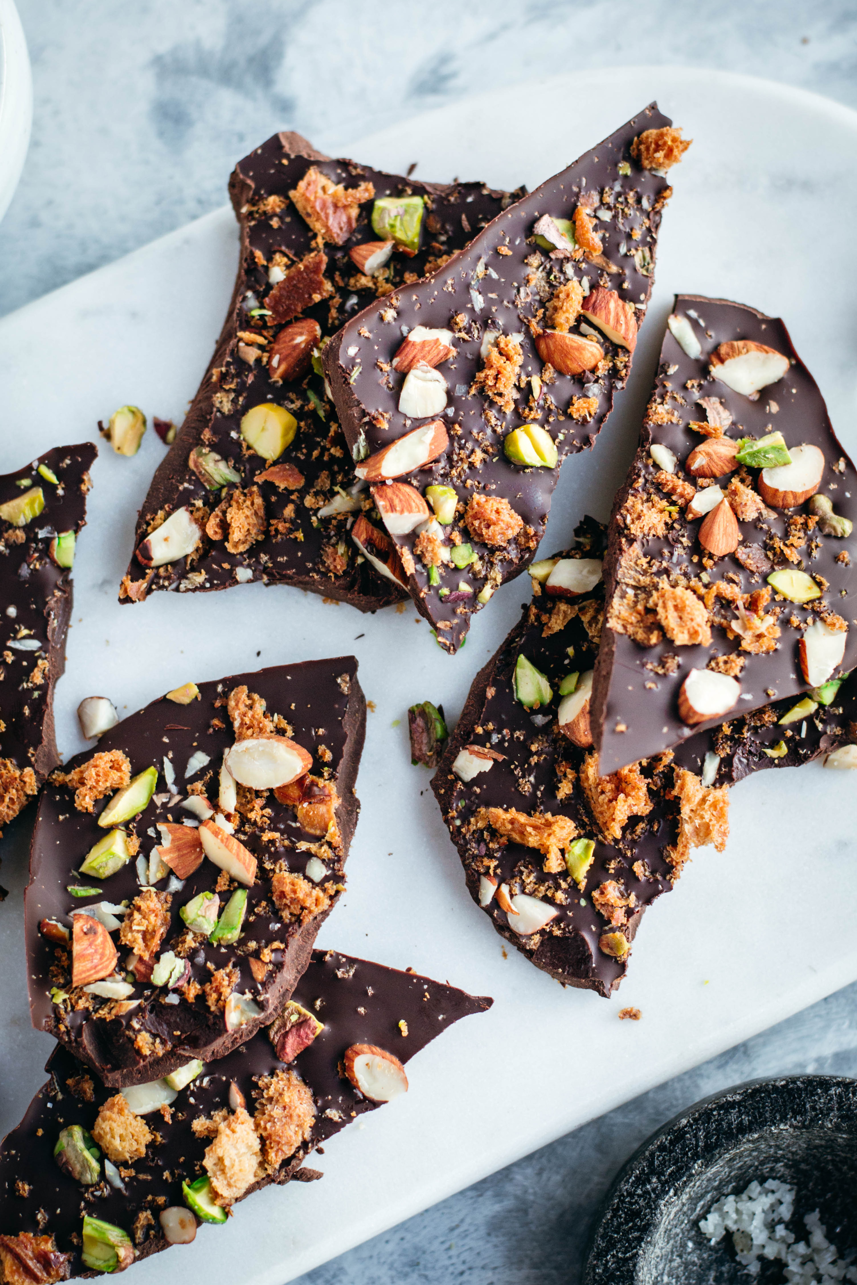 Homemade chocolate bark with nuts and toasted bread