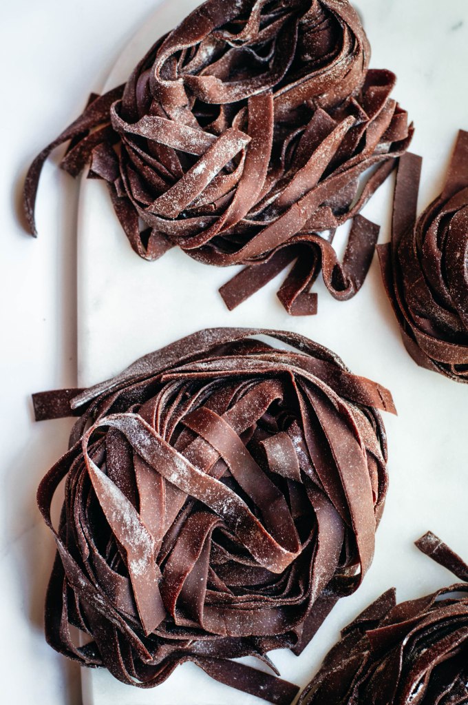 Fresh pasta is a labour of love and great pasta needs practice: these homemade cocoa tagliatelle are a wonderful way to step-up your pasta game pairing a very basic shape with cocoa powder and its characteristic flavours and colour. Delicious when served with melted cheese and spices, this fresh pasta with cocoa will definitely surprise you with its special taste.