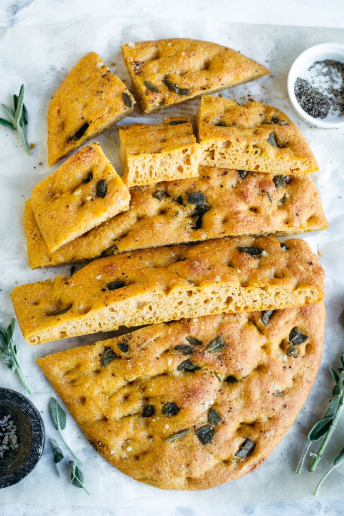 Delicious even when eaten on its own, this soft vegan pumpkin focaccia has a sweet finish and a pillowy texture, that may help this one to easily become one of your favourite recipes!