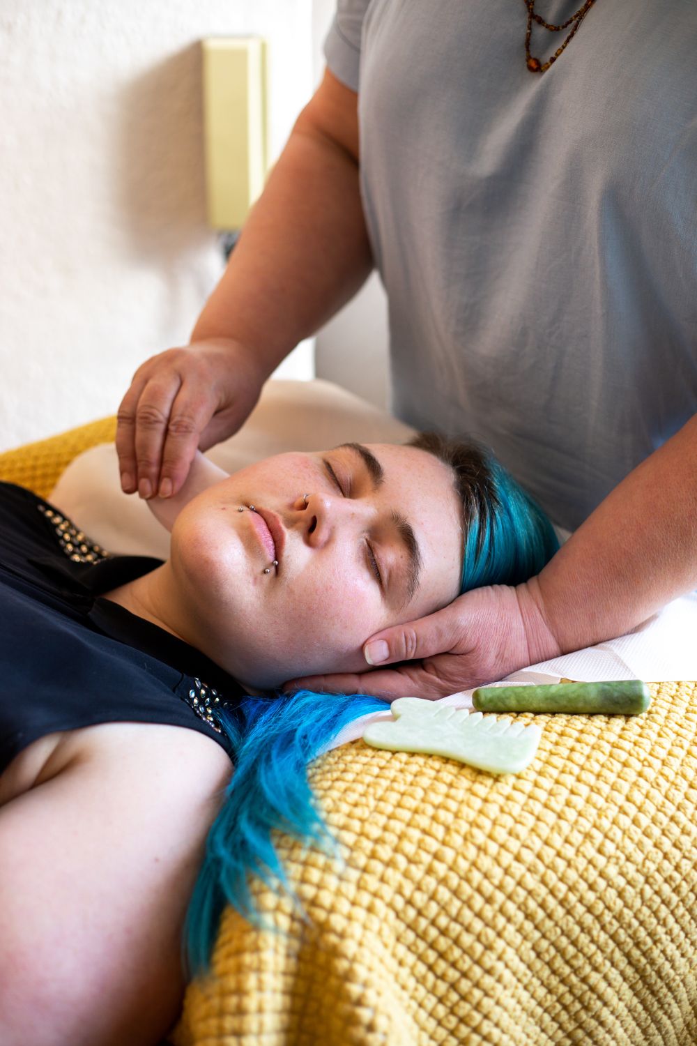 Woman receiving facial treatment at Amanda Nordell's Dublin wellness studio. Brand photography by Chiara Gianelli.