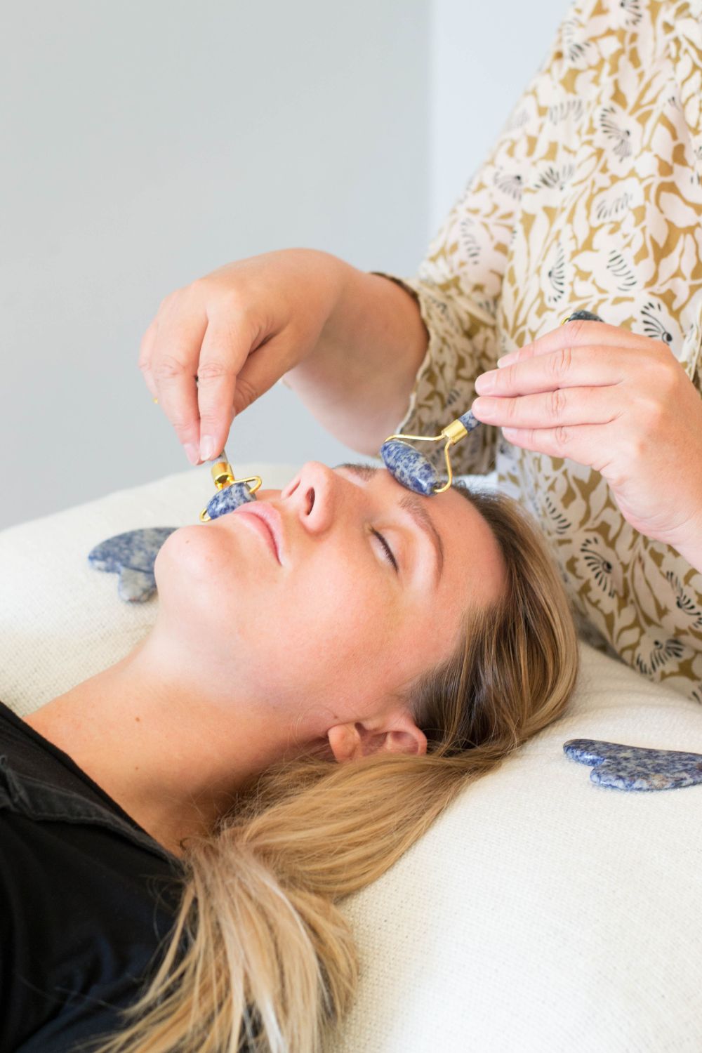 Woman receiving a facial treatment in a wellness studio. Brand photography by Chiara Gianelli.