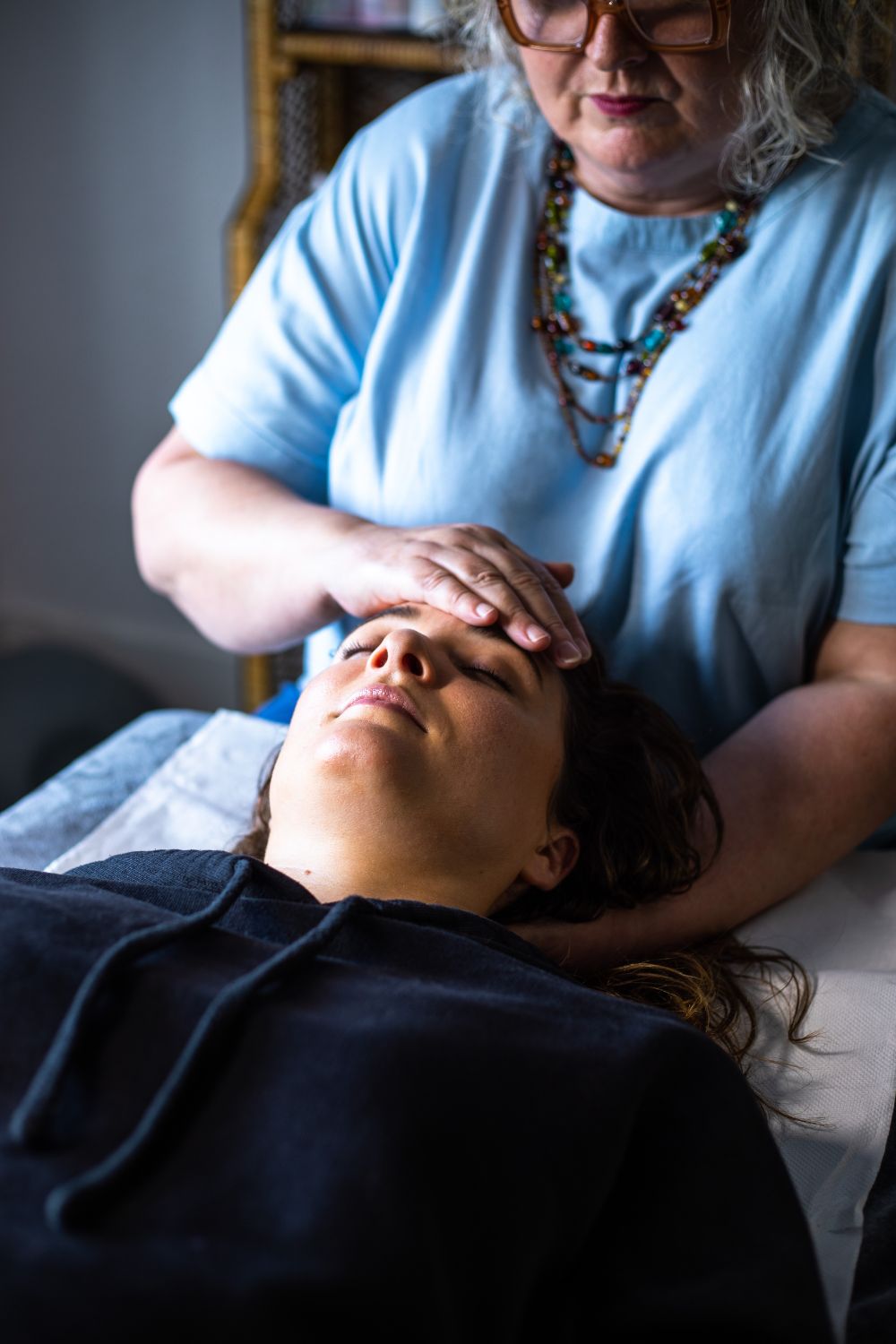 Woman receiving facial treatment at Amanda Nordell's Dublin wellness studio. Brand photography by Chiara Gianelli.