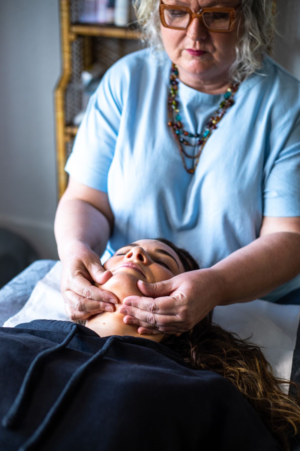 Woman receiving a facial treatment at Amanda Nordell's Dublin wellness studio. Brand photography by Chiara Gianelli.